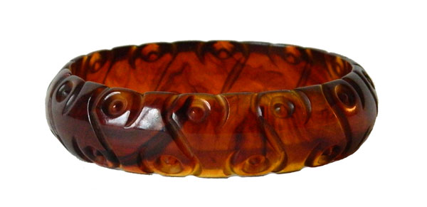 Carved dark amber bakelite bangle