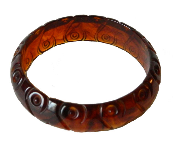 Carved dark amber bakelite bangle