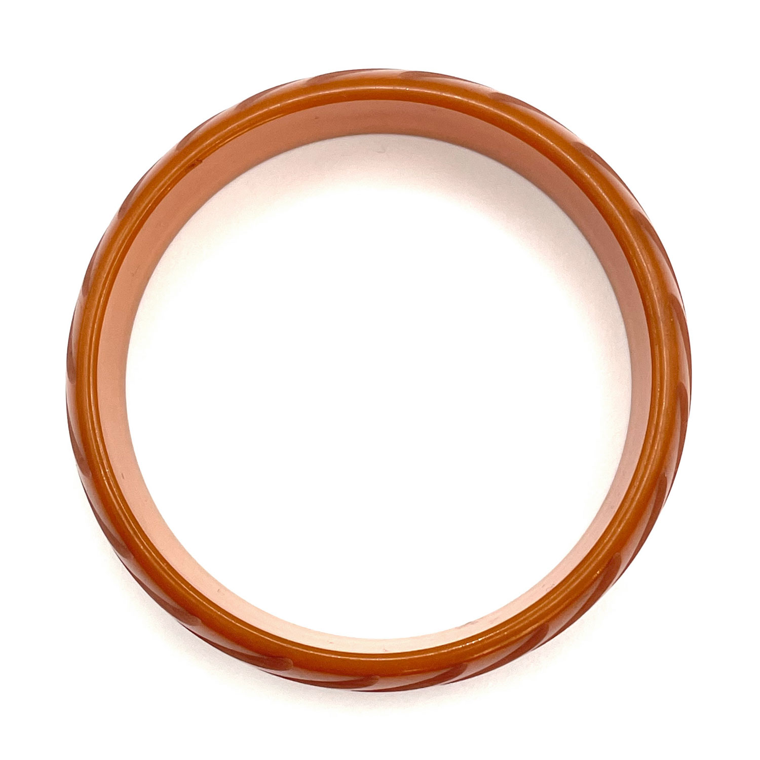 Carved orange bakelite bangle