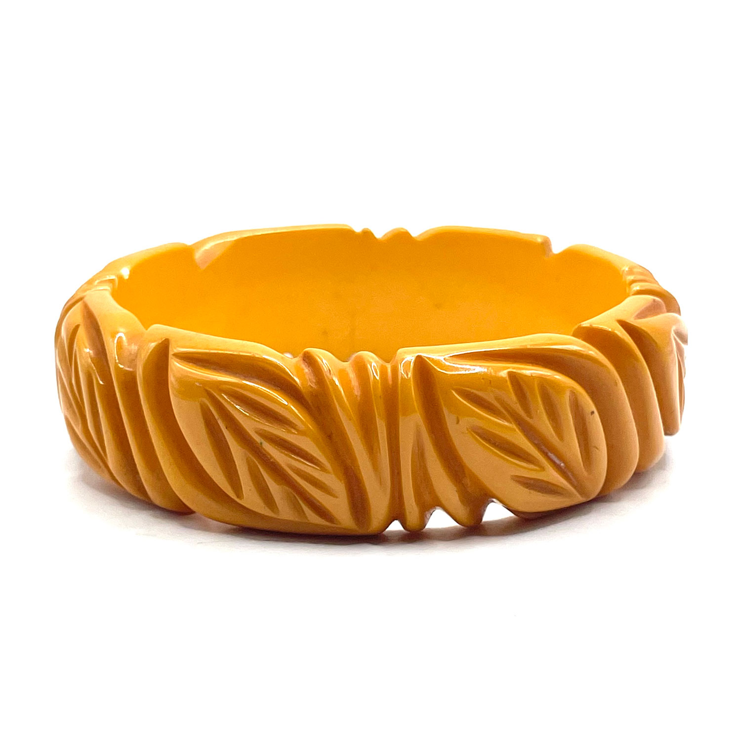 carved bakelite bangleDeeply carved yellow bakelite bangle