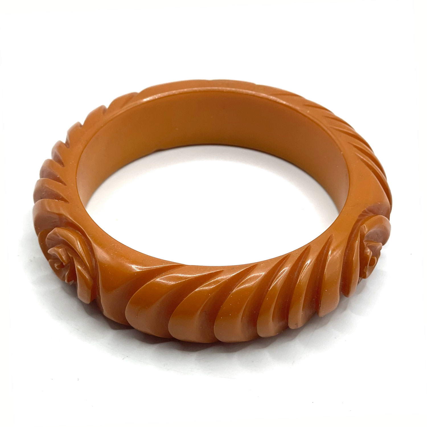 Carved orange bakelite bangle