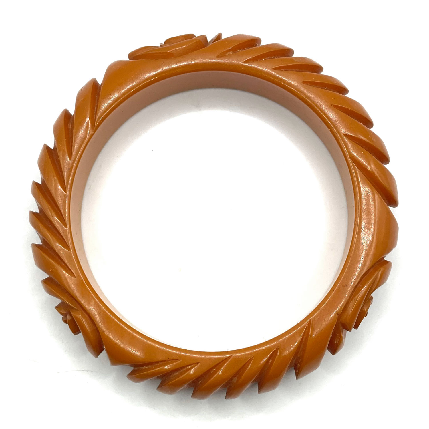 Carved orange bakelite bangle