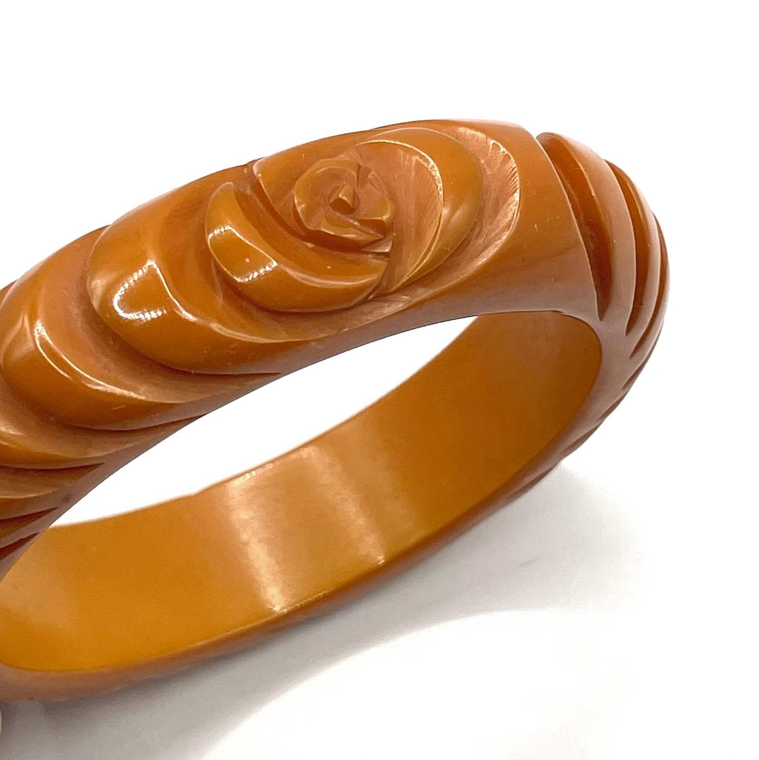 Carved orange bakelite bangle