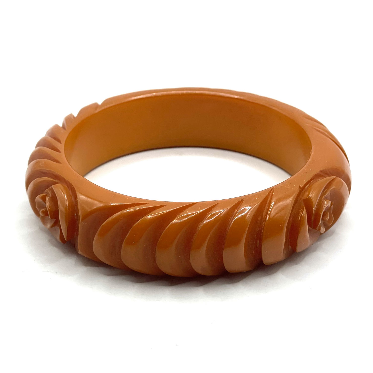 Carved orange bakelite bangle