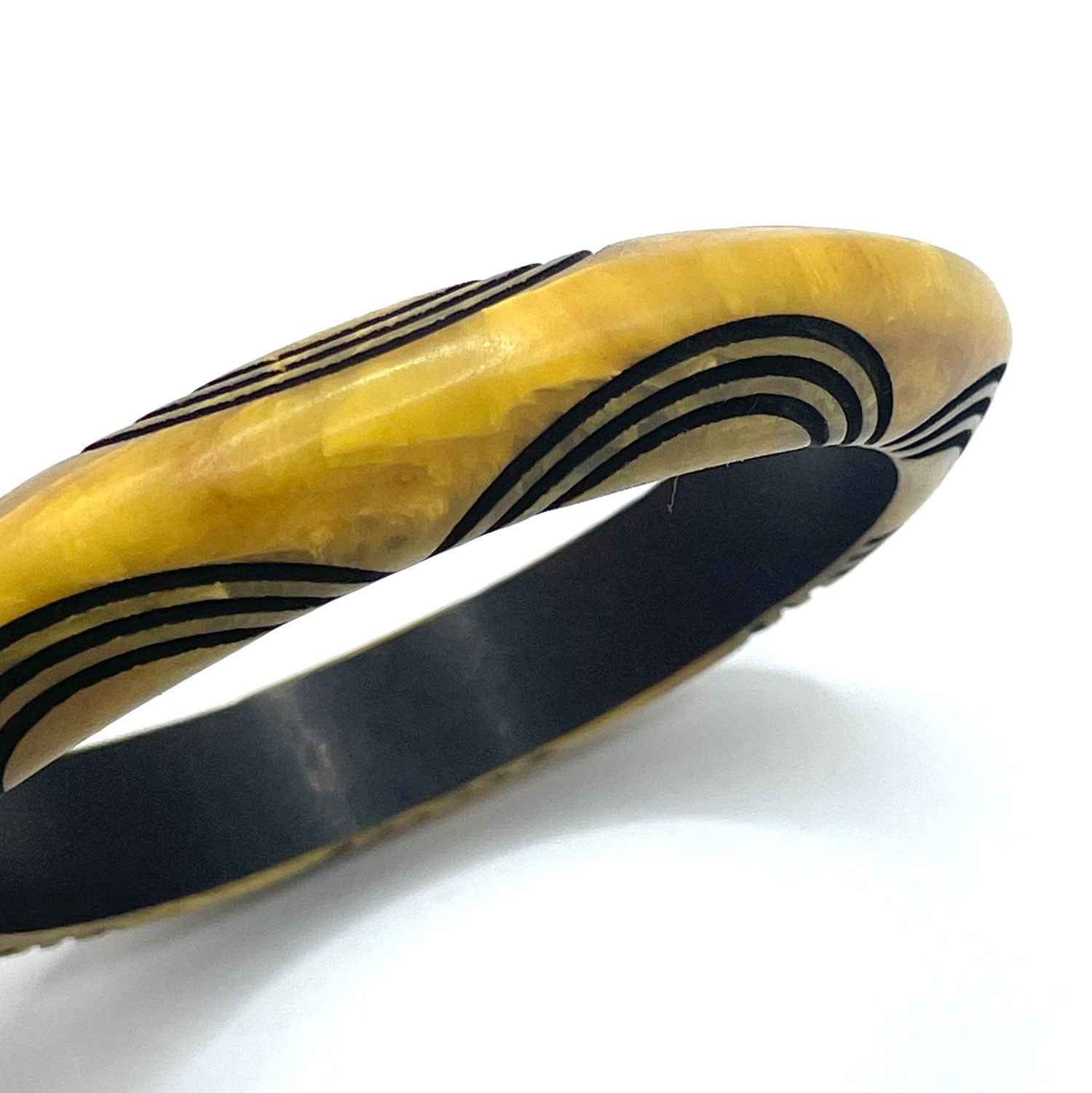 Carved overdyed bakelite bangle bracelet