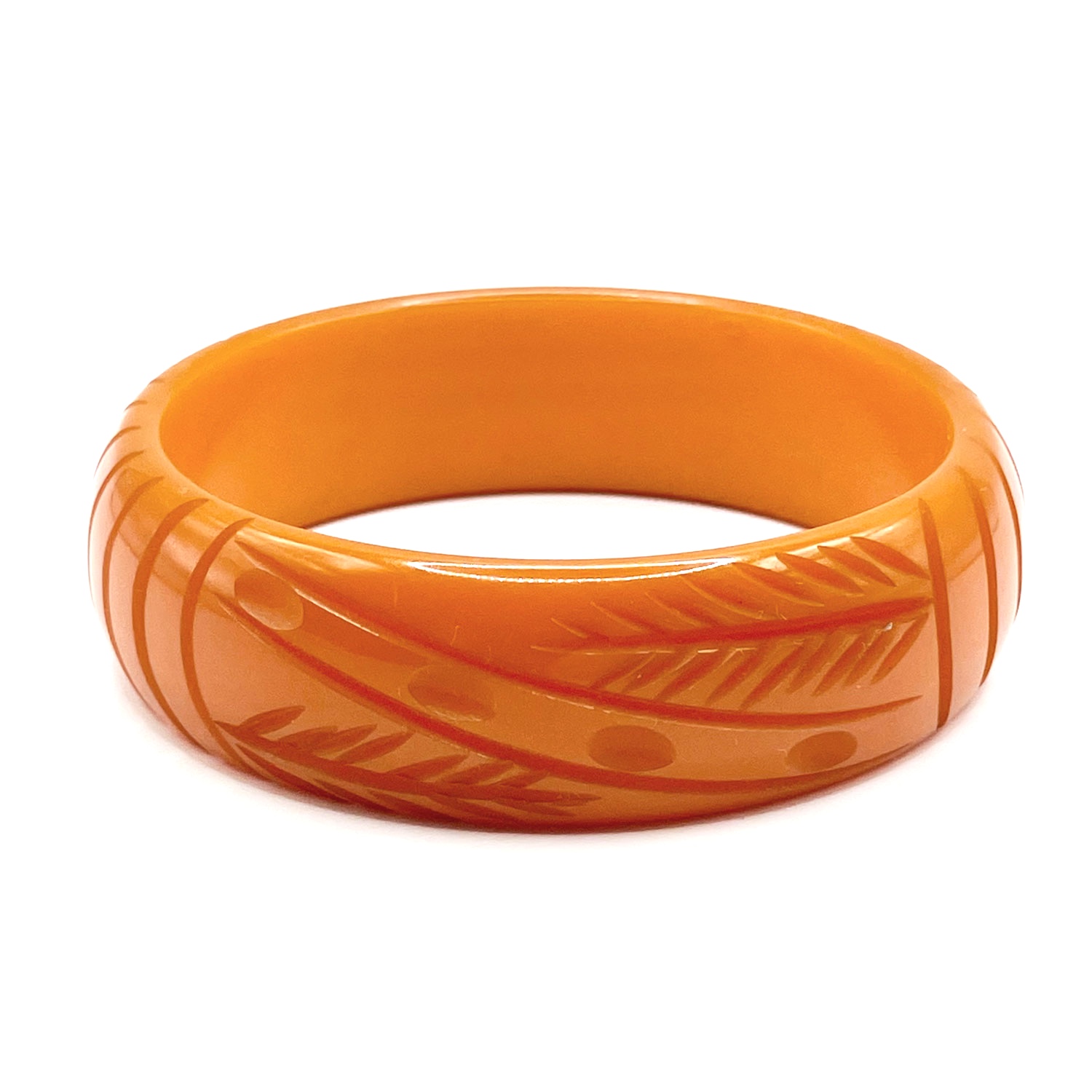 Carved orange bakelite bangle