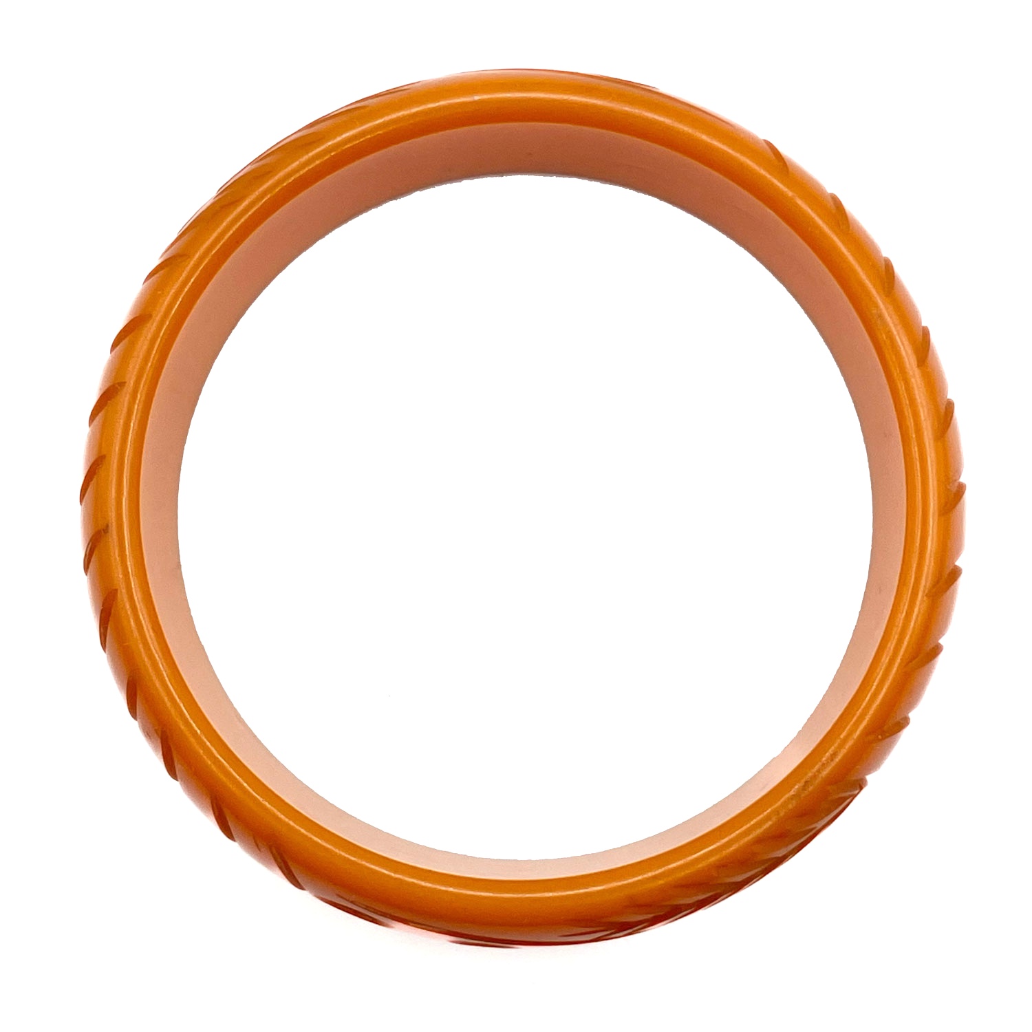 Carved orange bakelite bangle