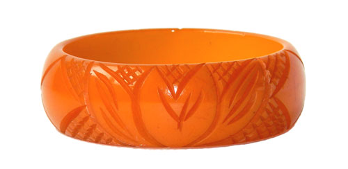 Carved orange bakelite bangle