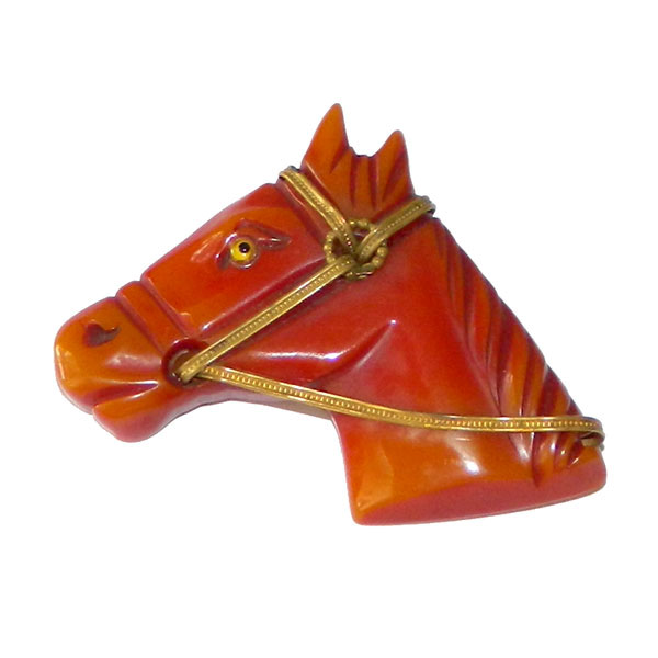 Hand carved bakelite horse head brooch