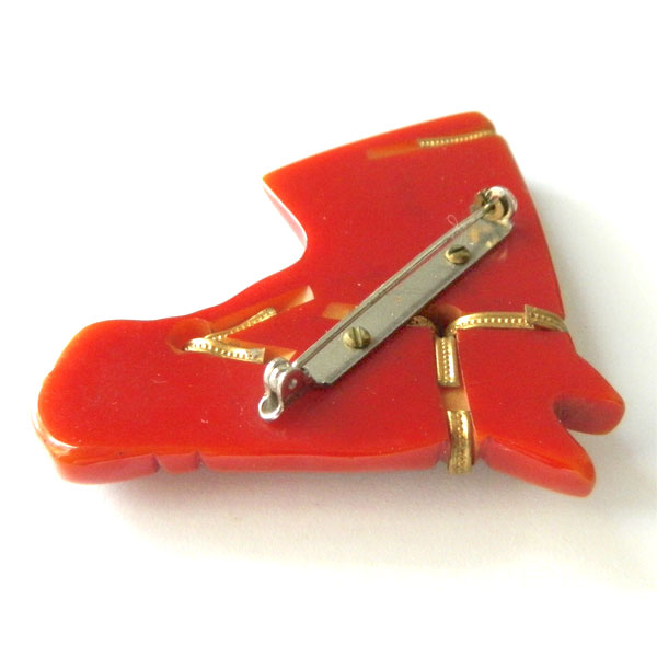 Hand carved bakelite brooch