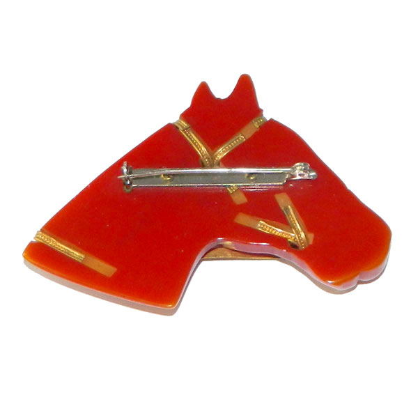 Hand carved bakelite brooch