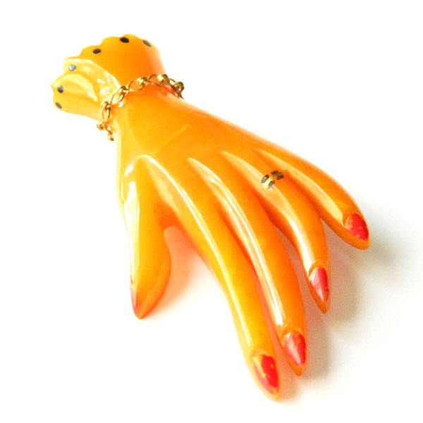 Bakelite hand brooch