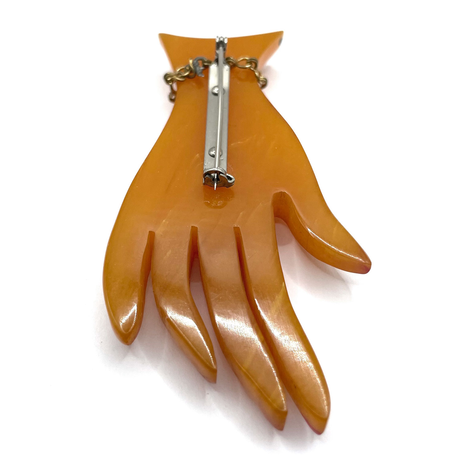 Bakelite hand brooch