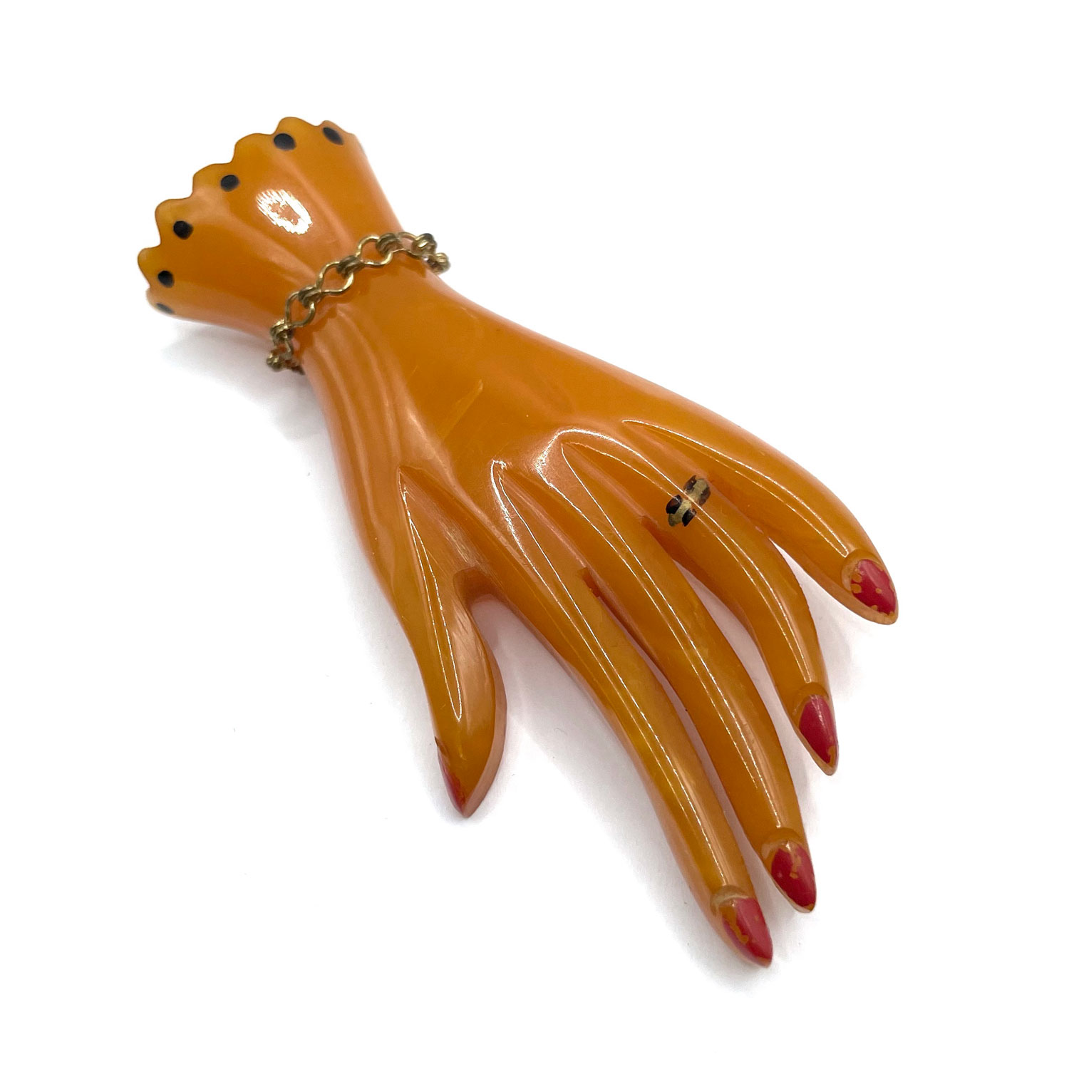 carved bakelite hand pin