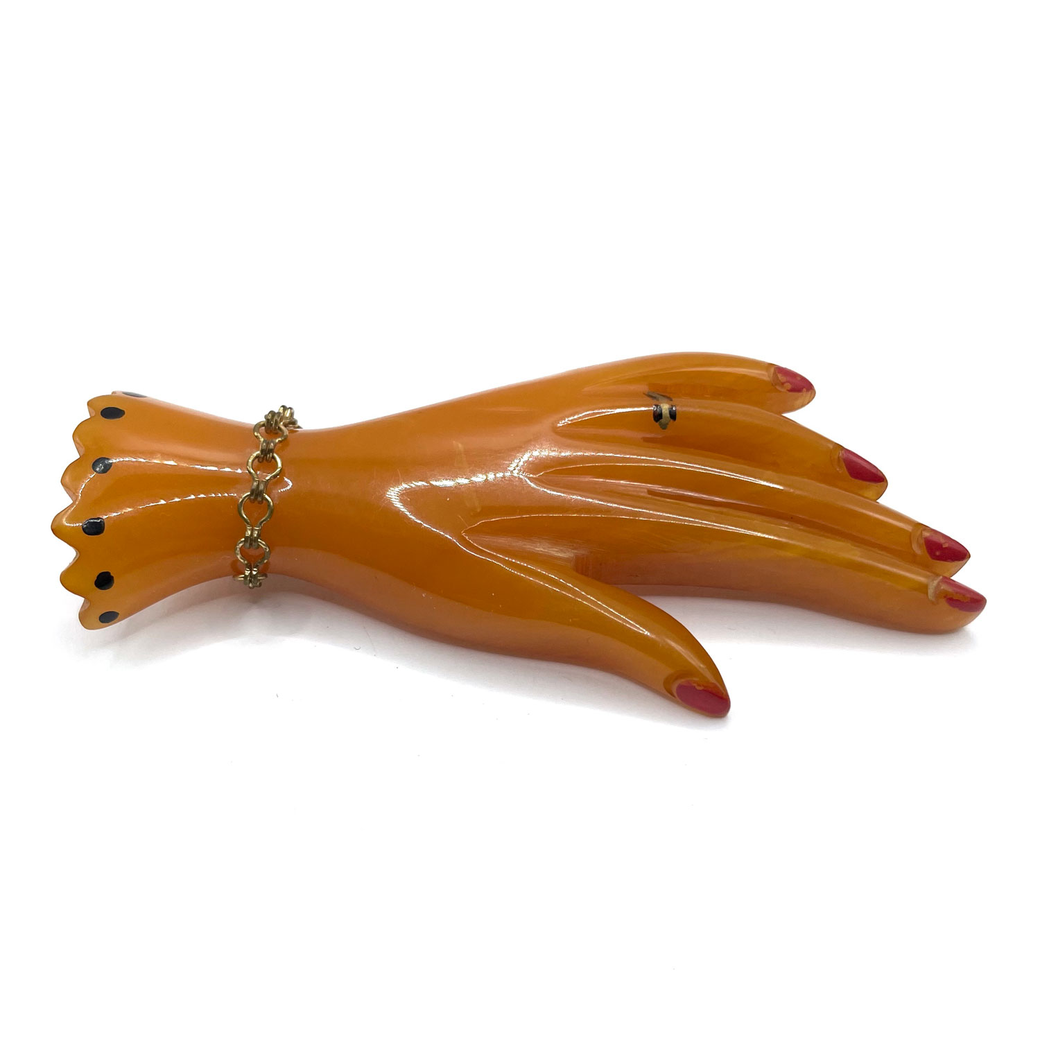 carved bakelite hand pin