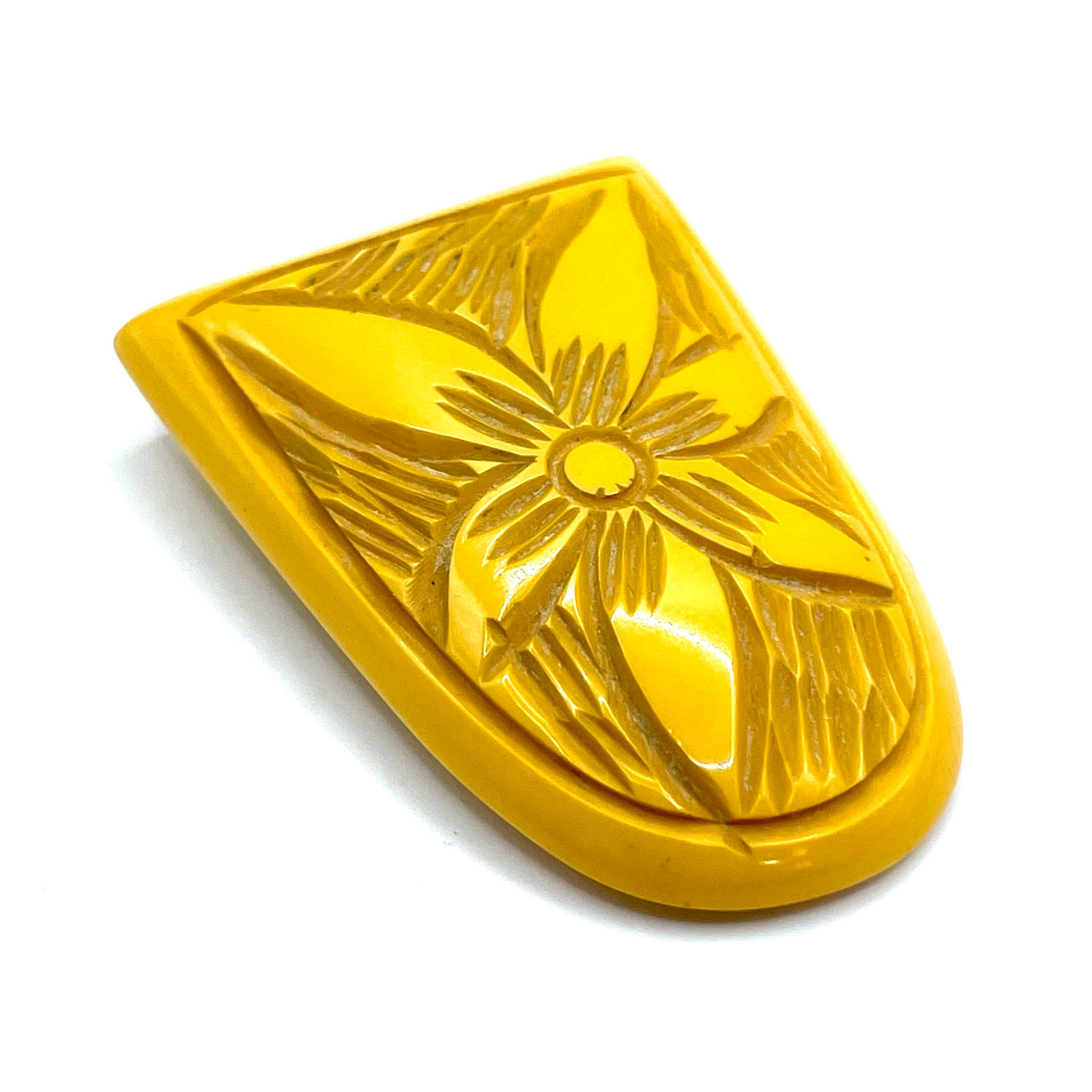carved bakelite dress clip