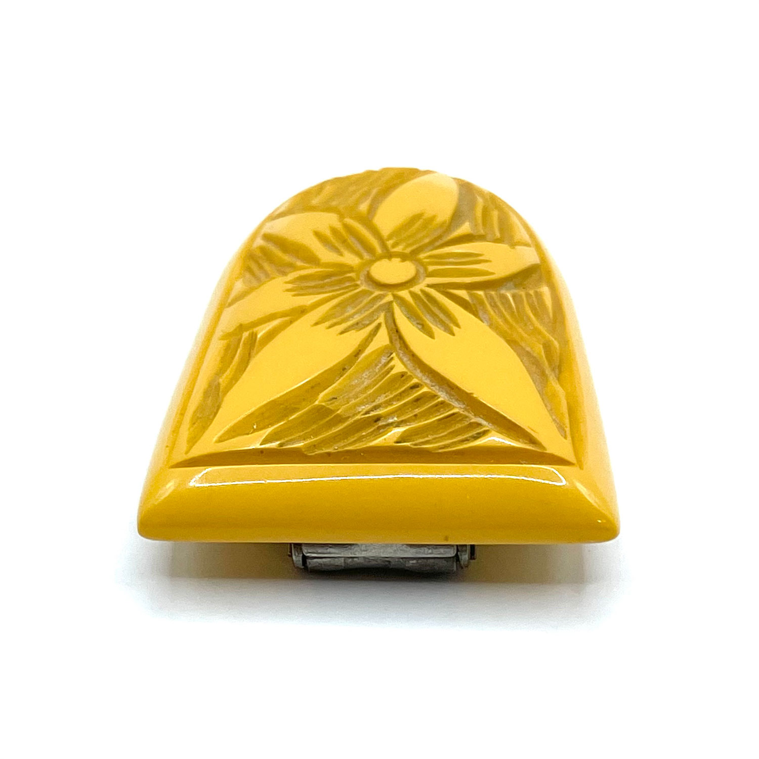 carved bakelite dress clip