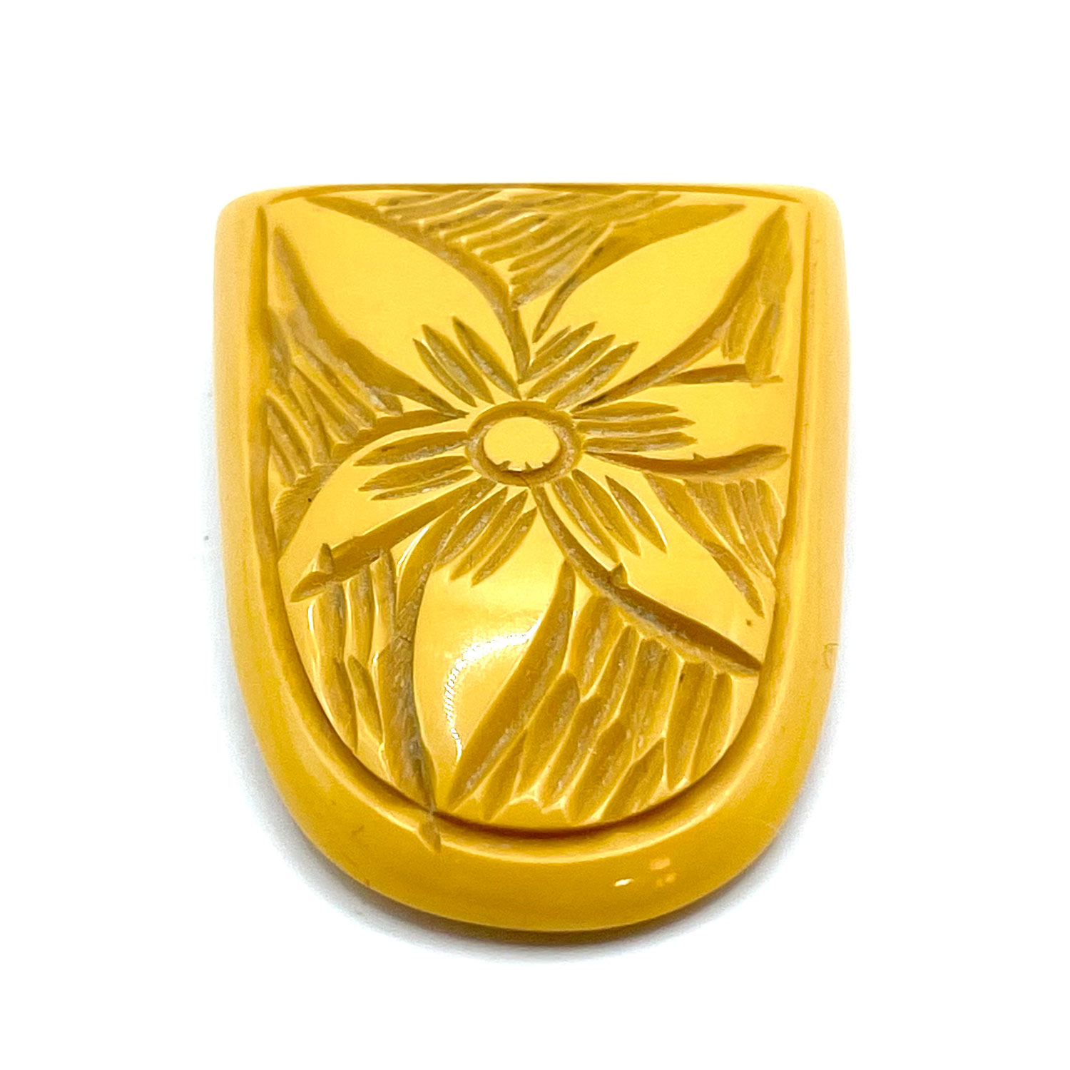 carved bakelite dress clip