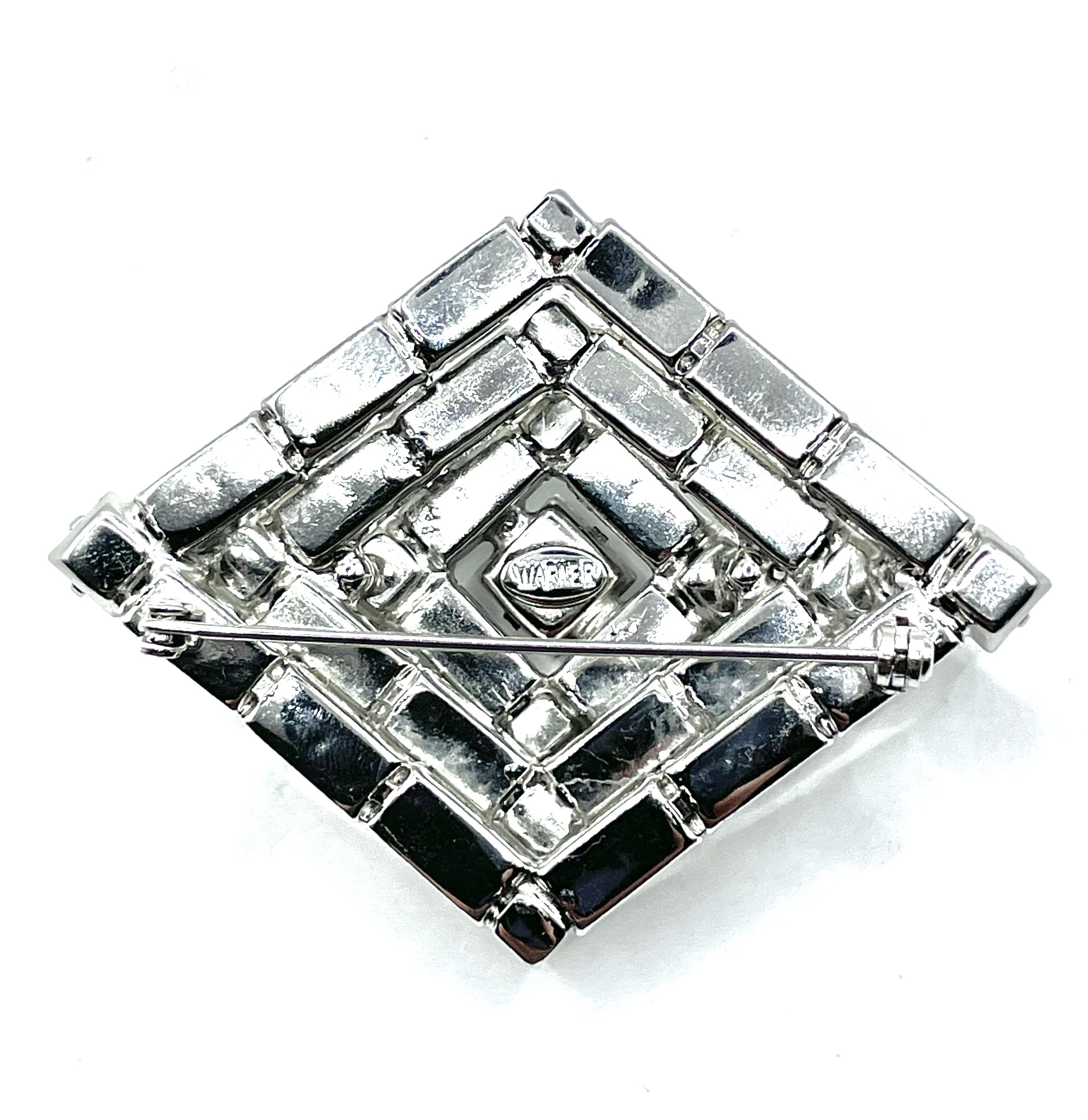 Warner rhinestone pin