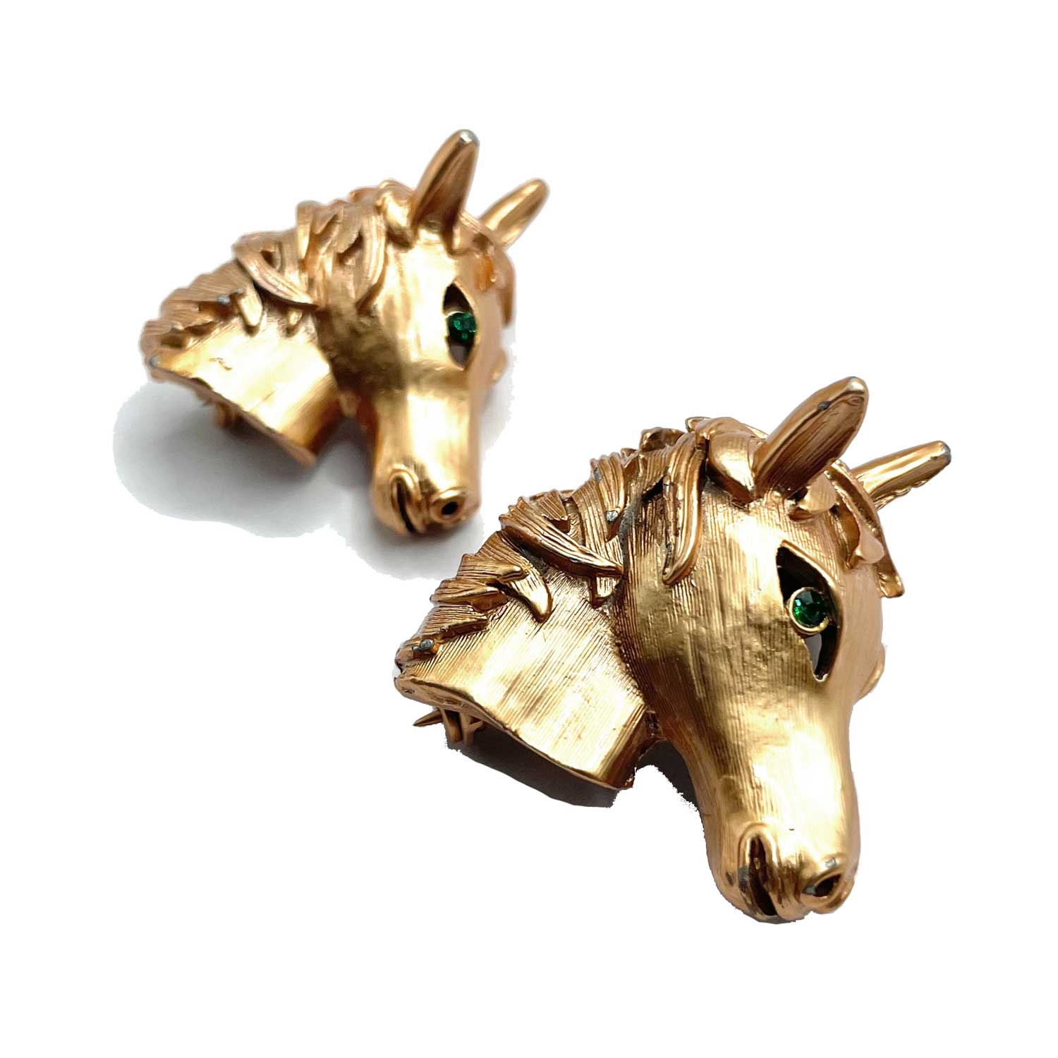 Pair of horse head brooches