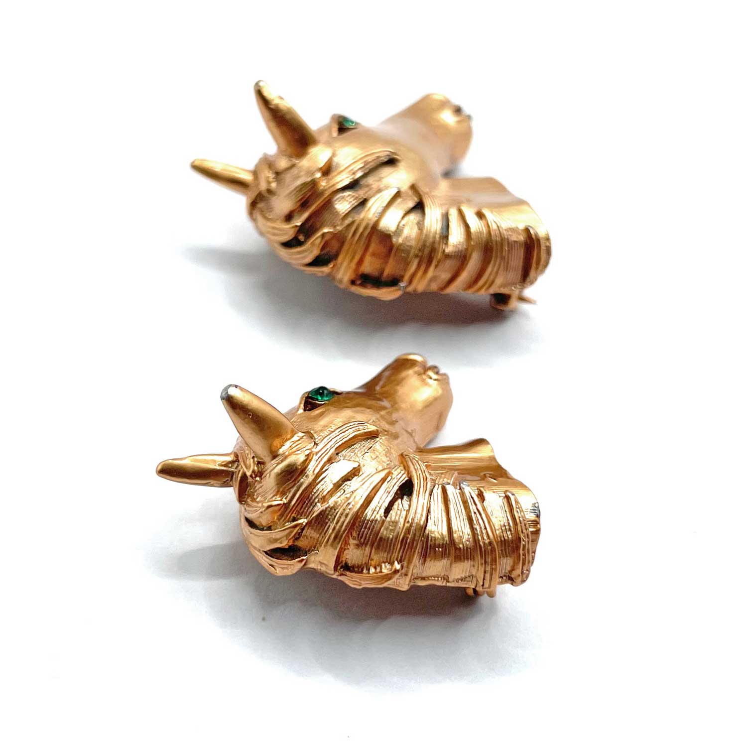 Pair of horse head brooches