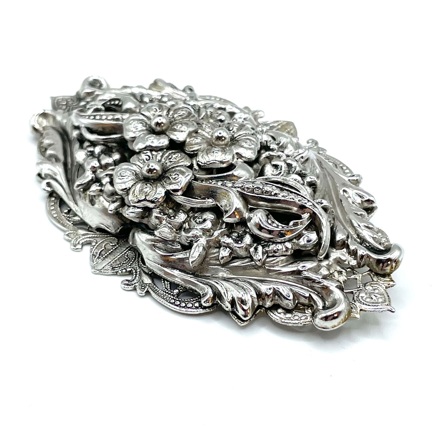Silver metal floral brooch