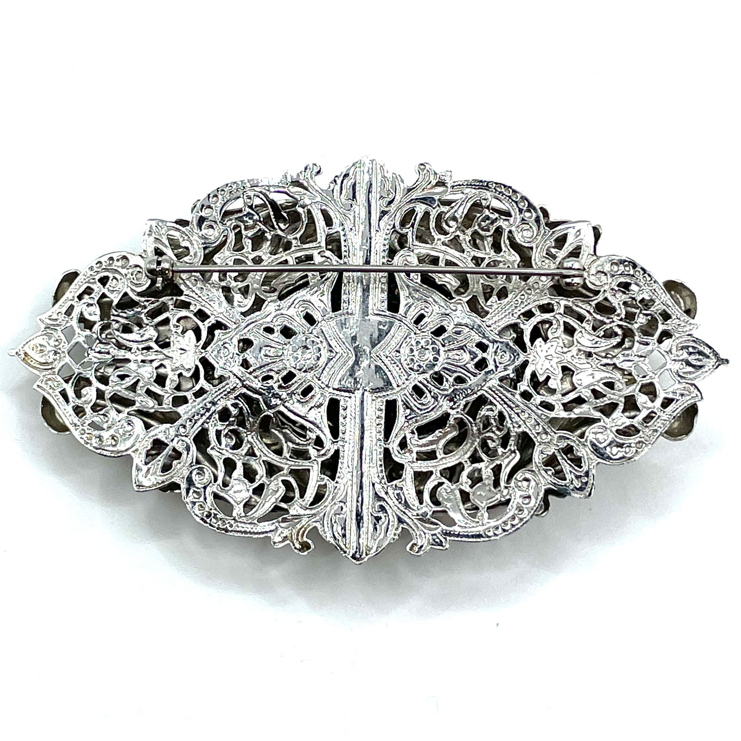 Silver metal floral brooch