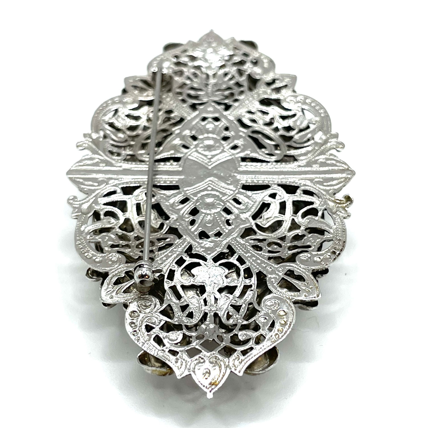 Silver metal floral brooch
