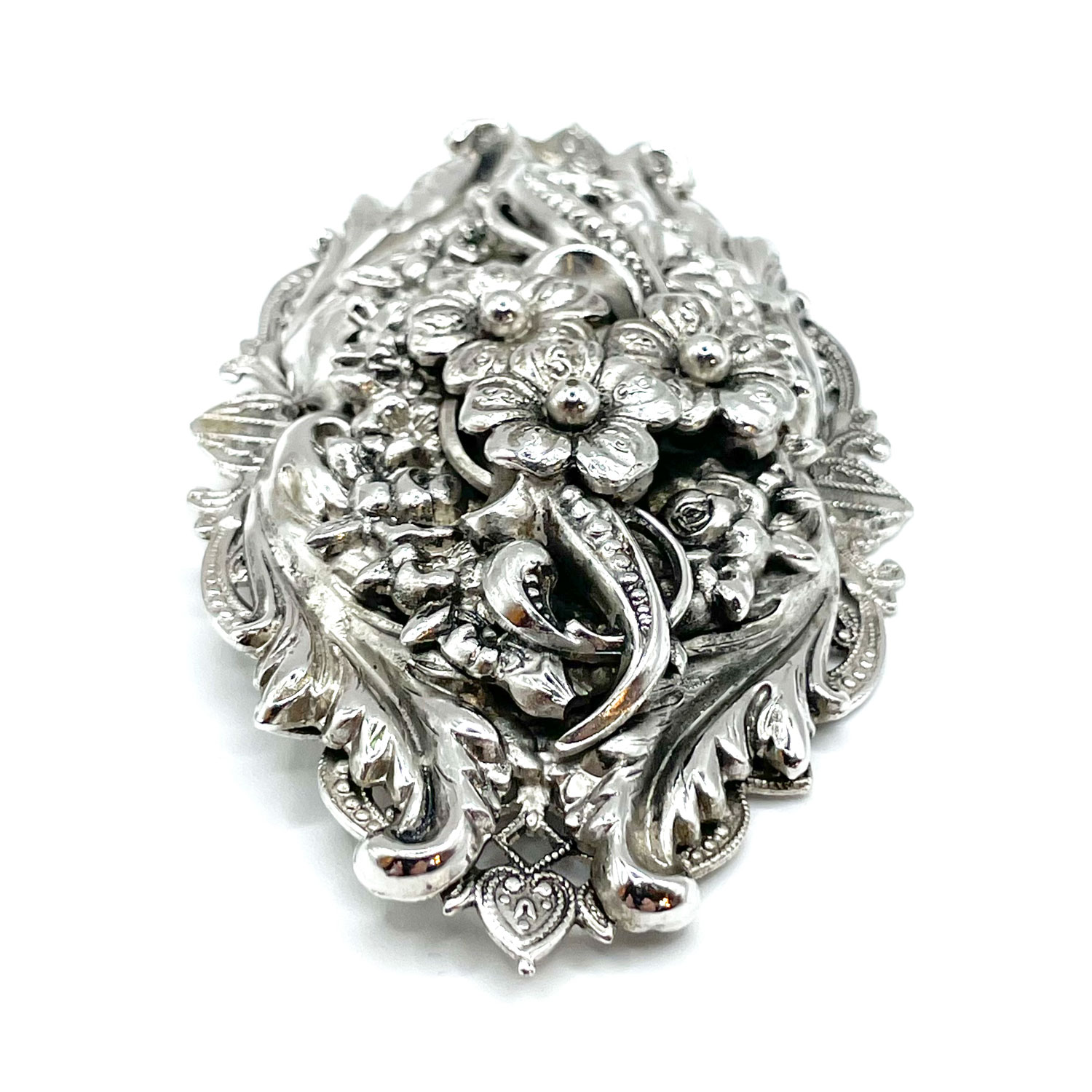 Silver metal floral brooch