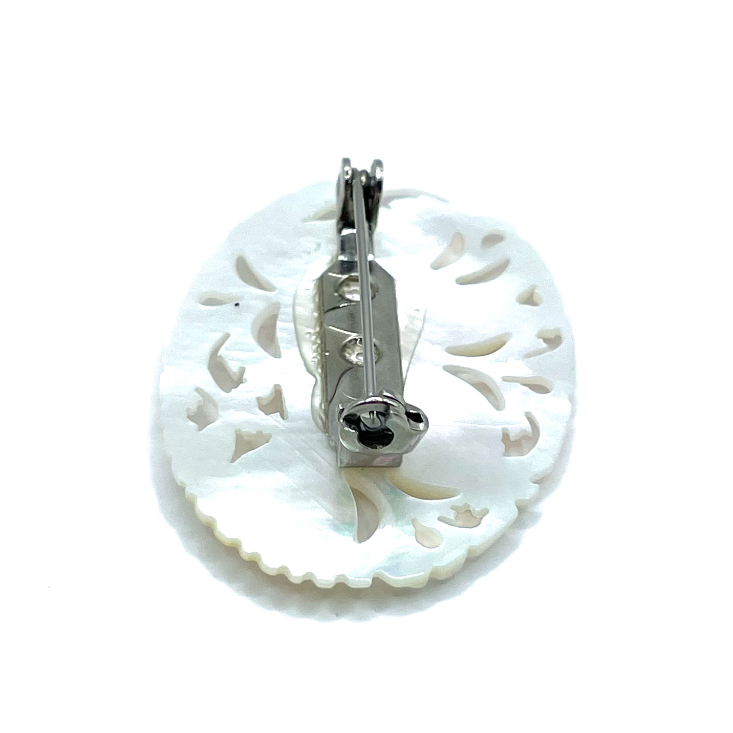 Hand carved mother of pearl brooch