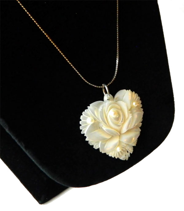 Carved mother of pearl pendant necklace