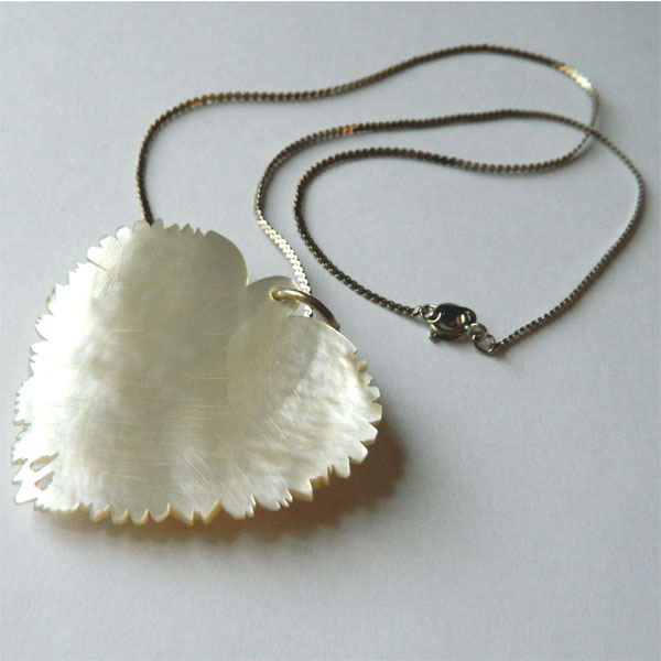 Carved mother of pearl pendant necklace