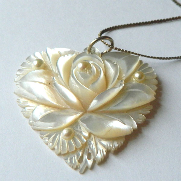 Carved mother of pearl pendant necklace