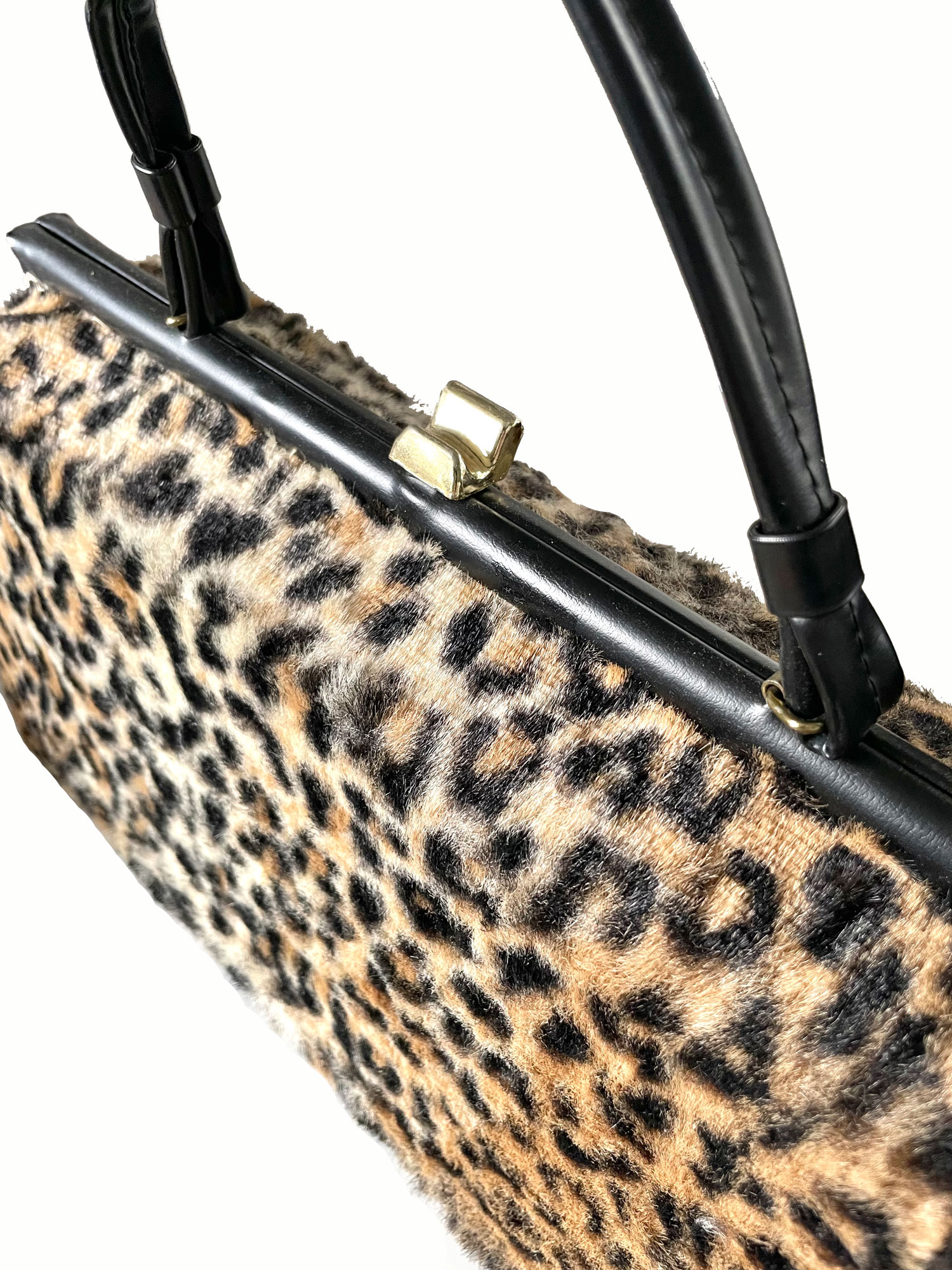 Faux leopard fur top handle purse